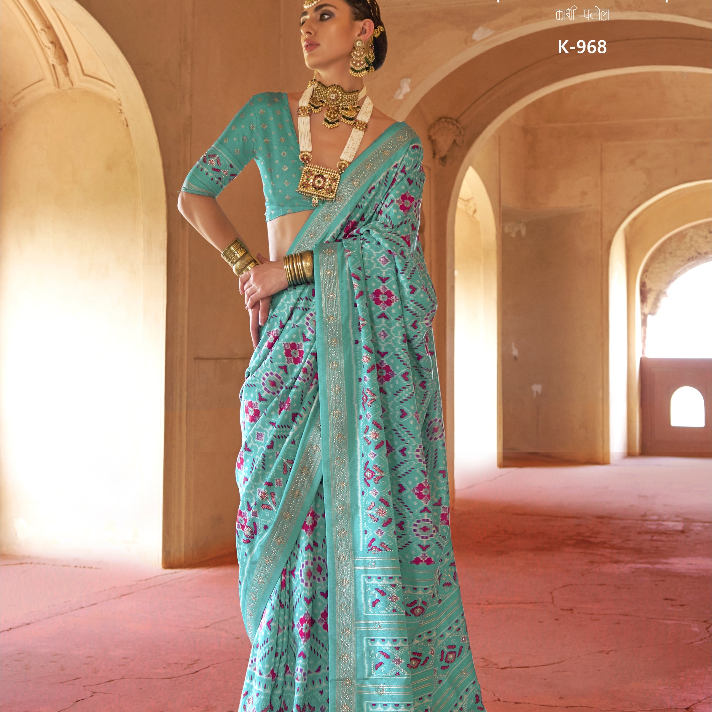 Firozi Teal Blue Silk Saree with Magenta Ikat Accents and Shimmering Gold Zari Border
