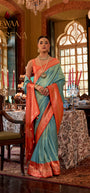 Rewaa Devsena R-683 Regal Seafoam Blue Banarasi Silk Saree with Vibrant Orange Zari Border
