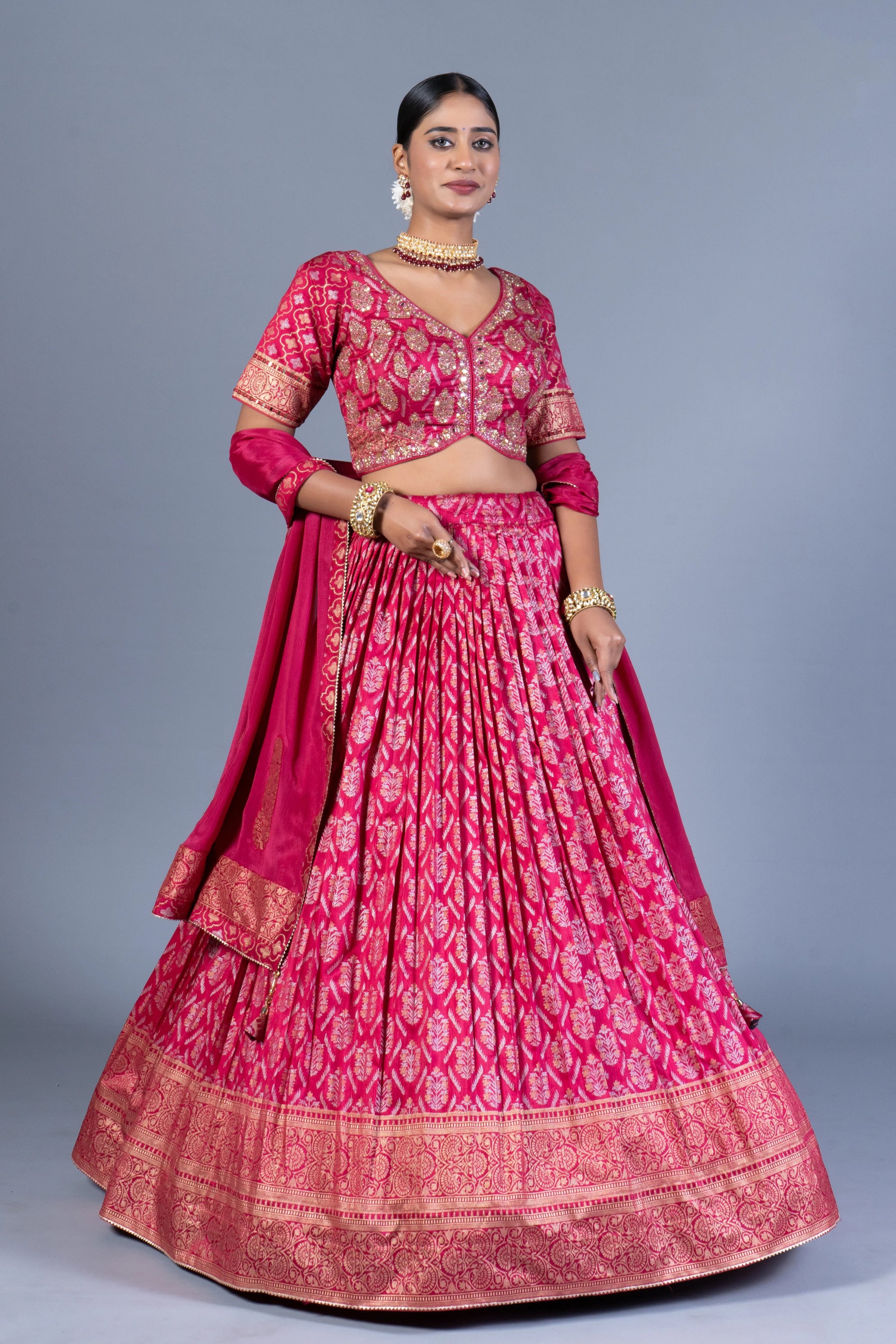 Rani Pink Patola Print Pleated Lehenga Choli with Embroidered Silk Blouse and Zari Border