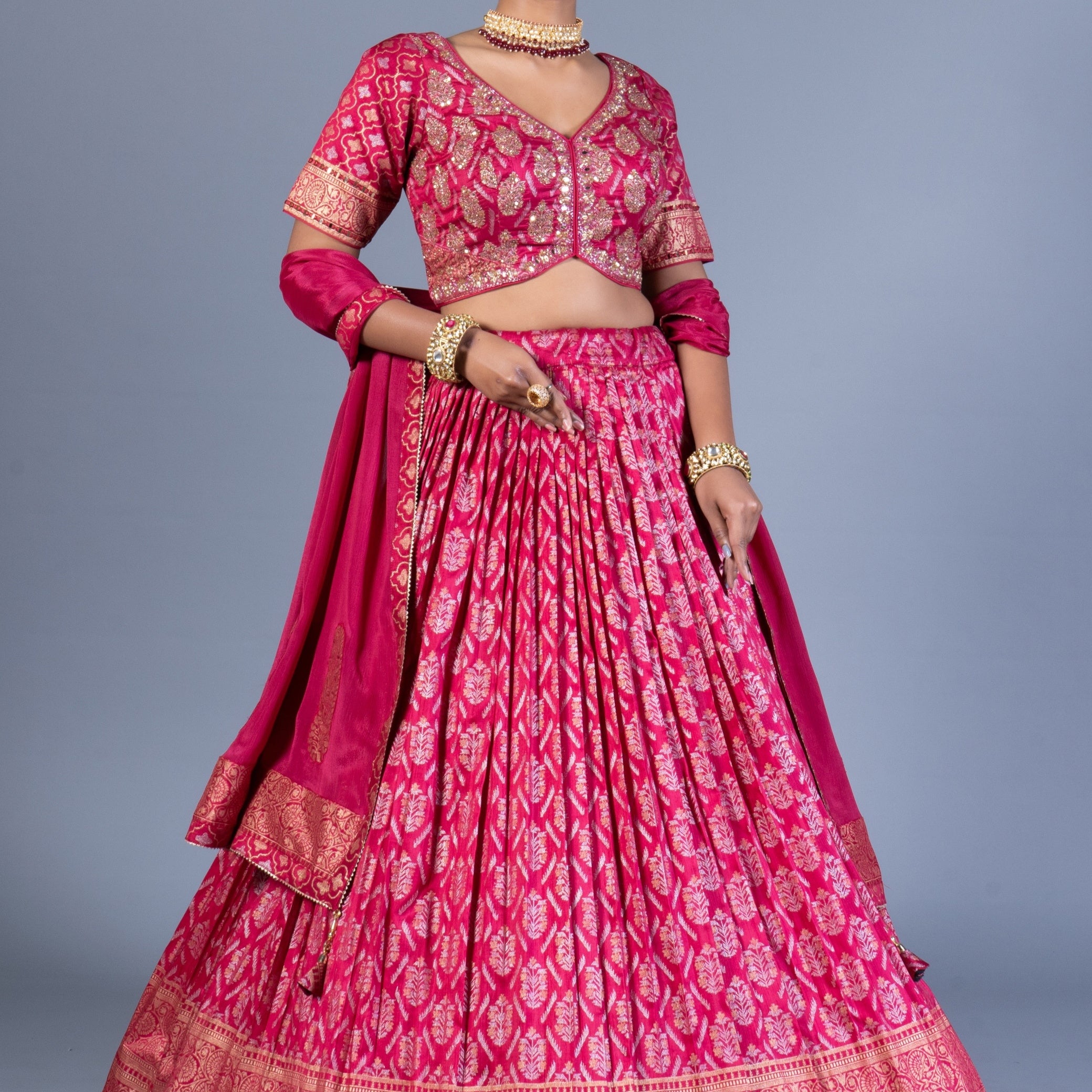 Rani Pink Patola Print Pleated Lehenga Choli with Embroidered Silk Blouse and Zari Border