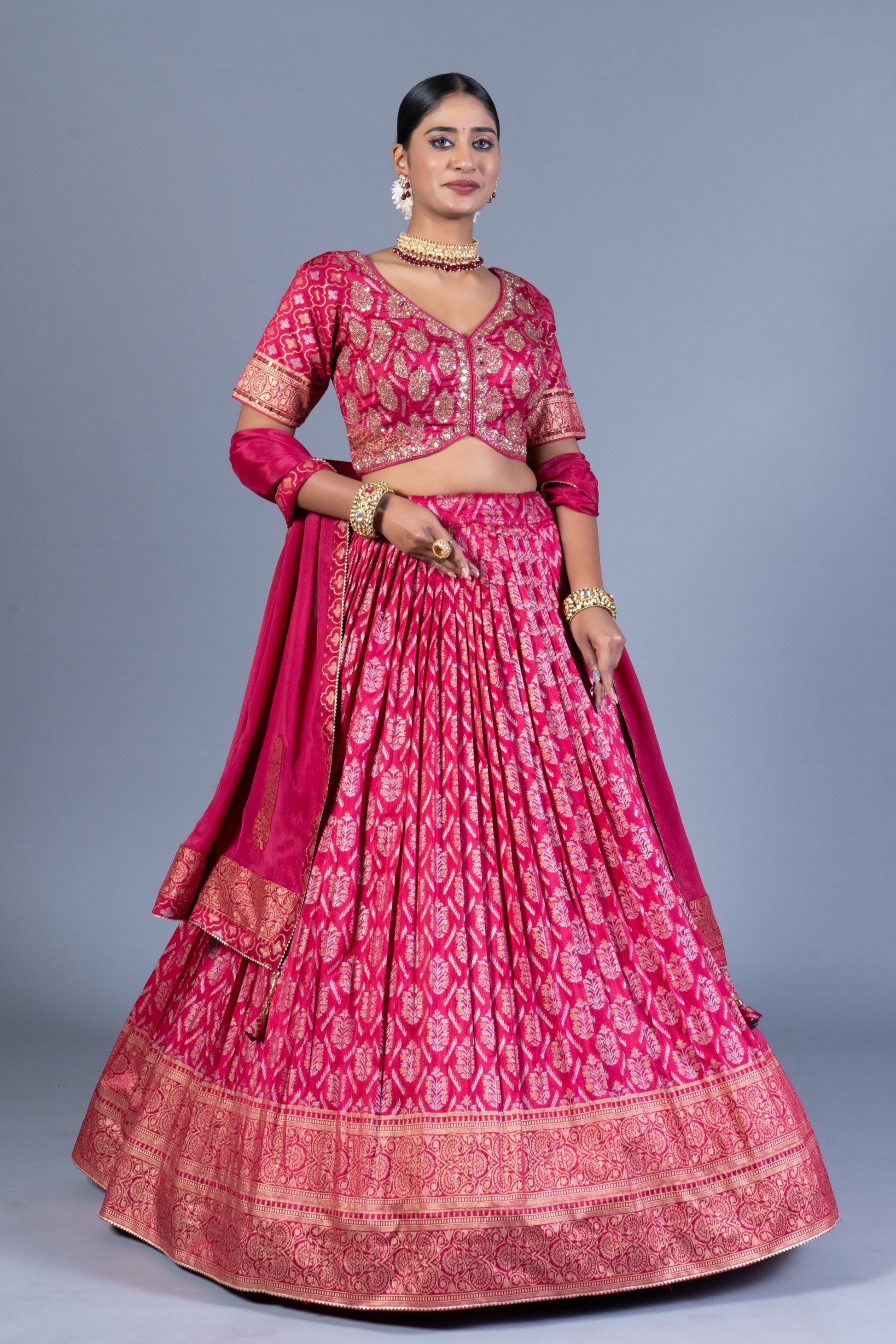 Rani Pink Patola Print Pleated Lehenga Choli with Embroidered Silk Blouse and Zari Border