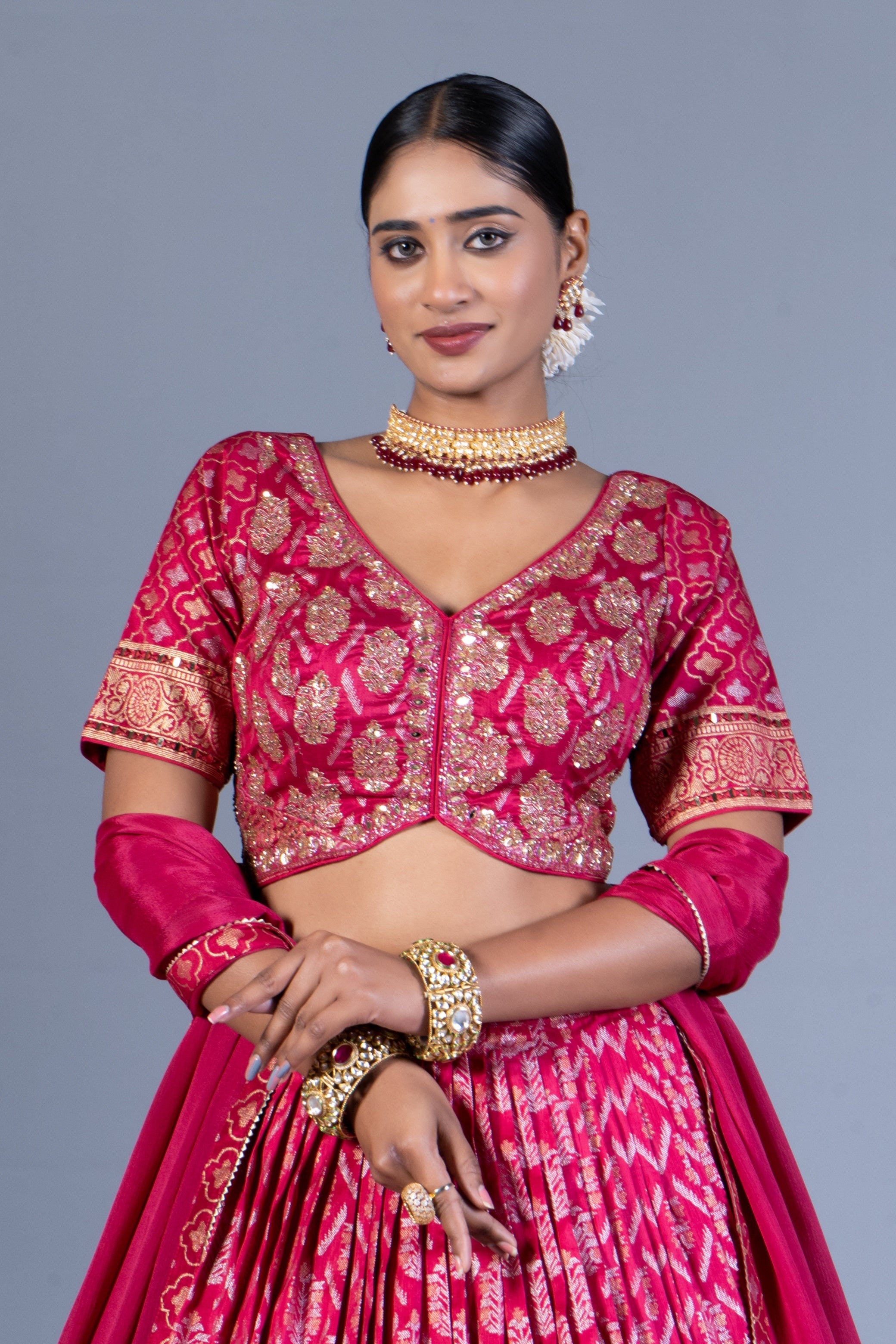 Rani Pink Patola Print Pleated Lehenga Choli with Embroidered Silk Blouse and Zari Border