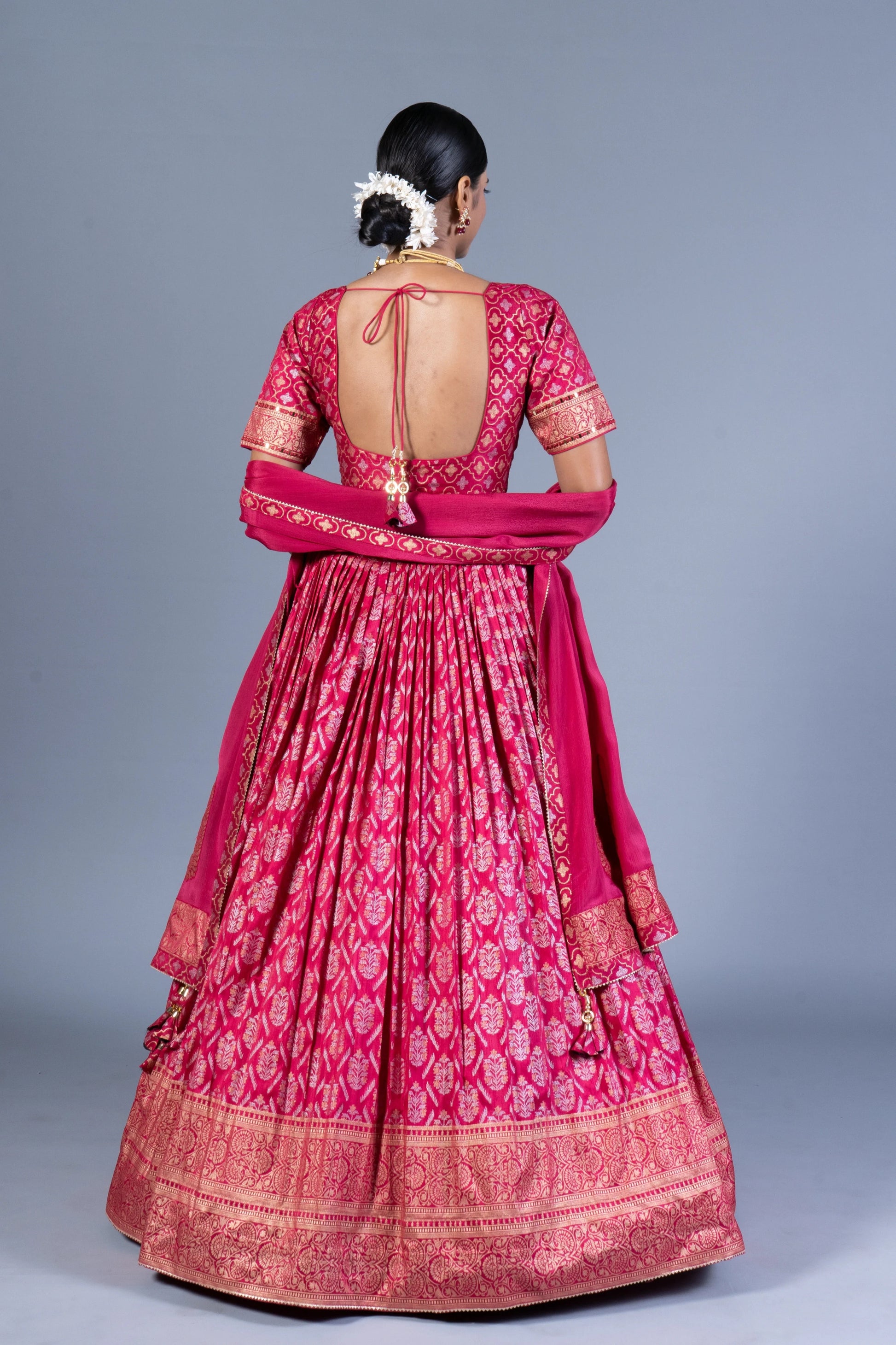 Rani Pink Patola Print Pleated Lehenga Choli with Embroidered Silk Blouse and Zari Border