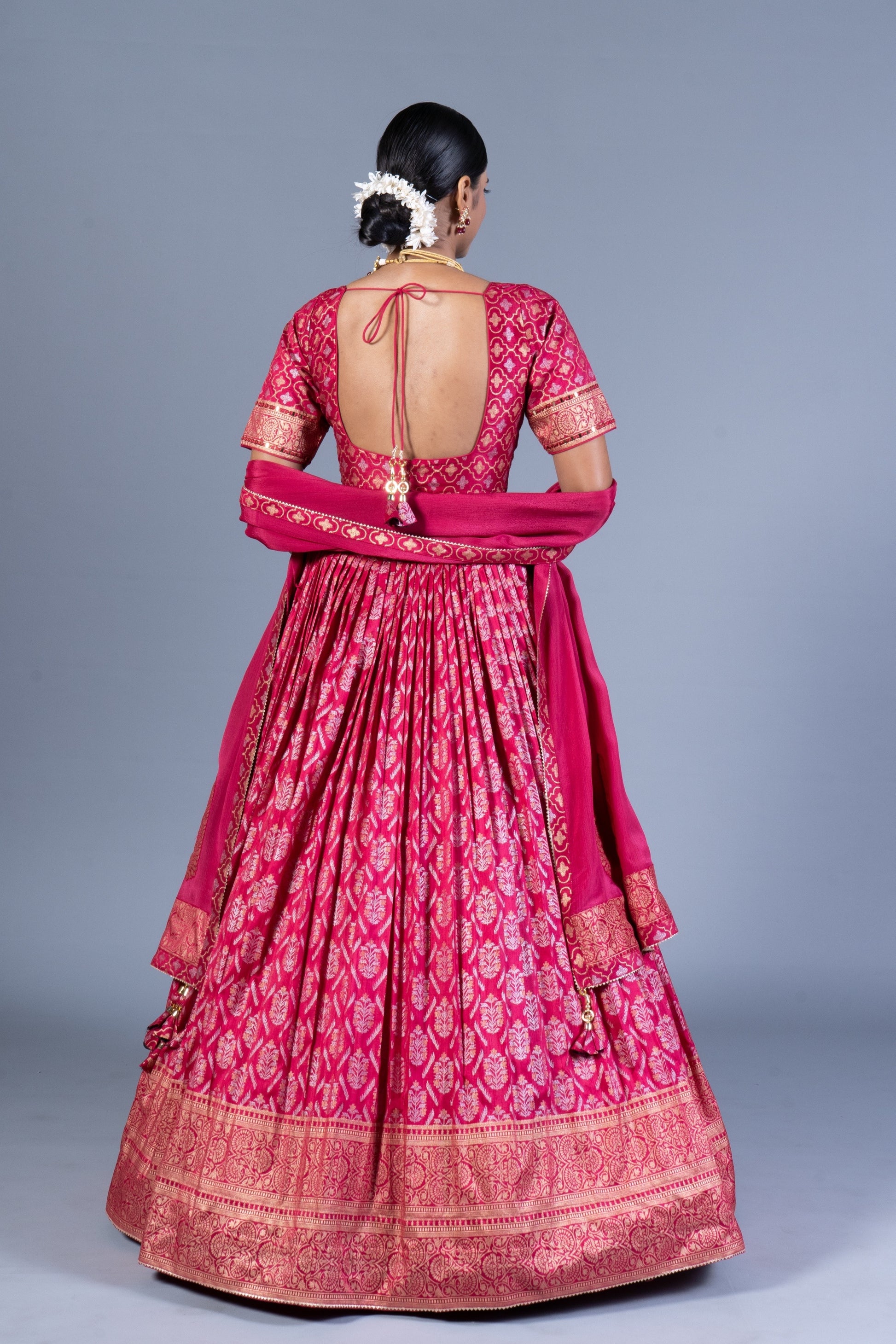 Rani Pink Patola Print Pleated Lehenga Choli with Embroidered Silk Blouse and Zari Border