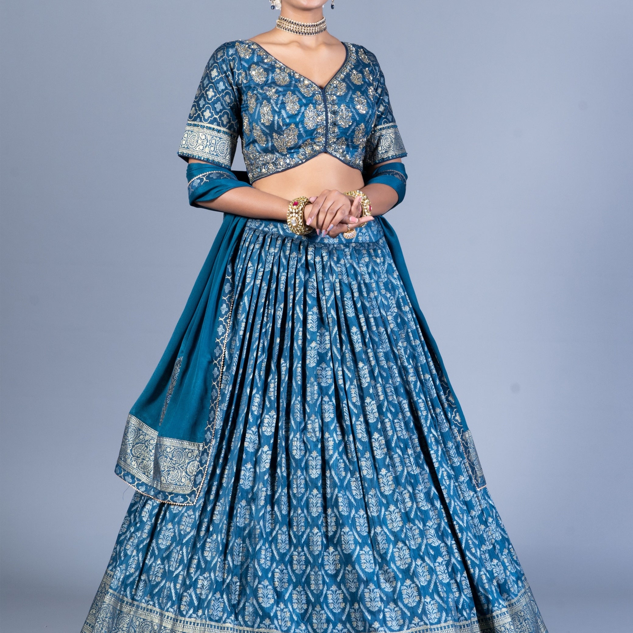Teal Blue Patola Print Pleated Lehenga Choli with Embroidered Silk Blouse and Zari Border