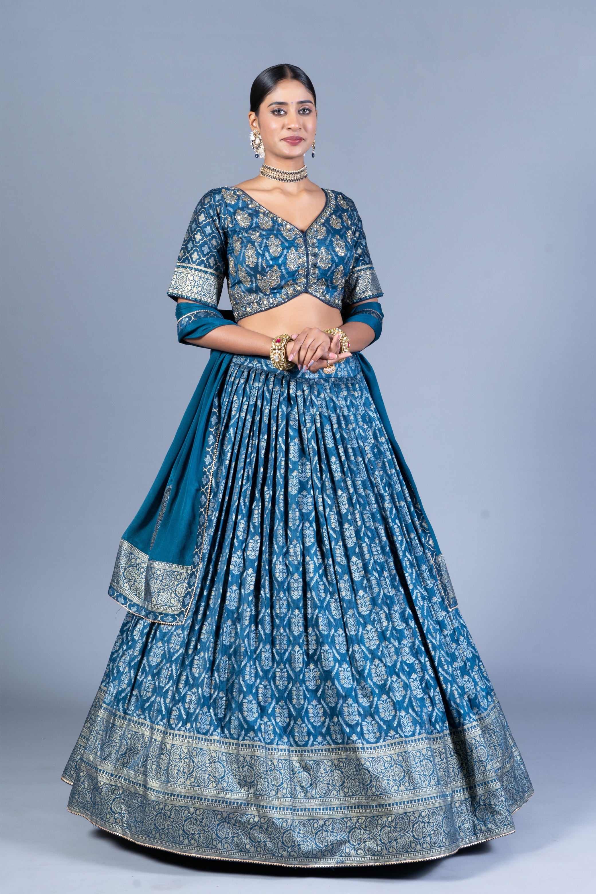 Teal Blue Patola Print Pleated Lehenga Choli with Embroidered Silk Blouse and Zari Border