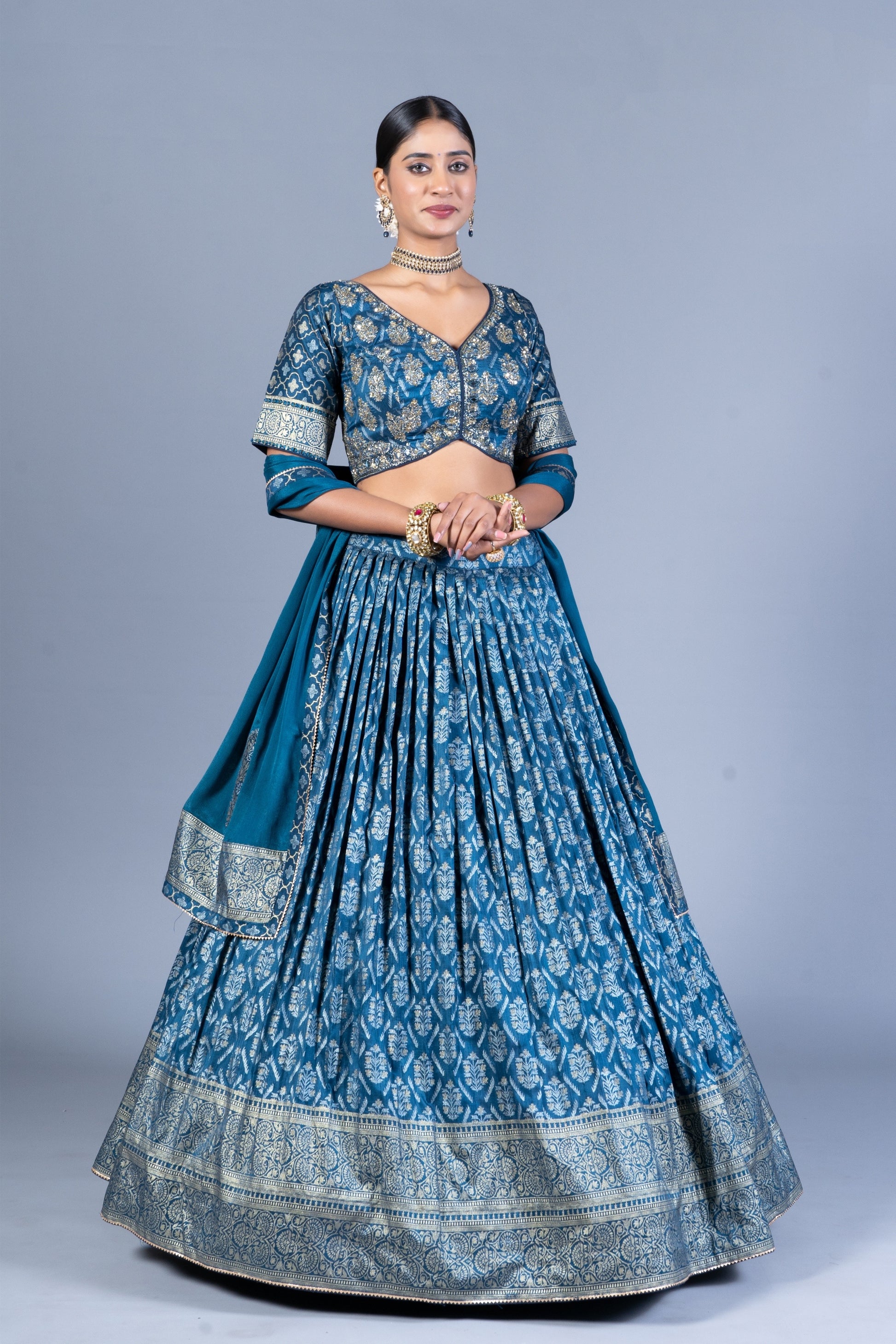 Teal Blue Patola Print Pleated Lehenga Choli with Embroidered Silk Blouse and Zari Border