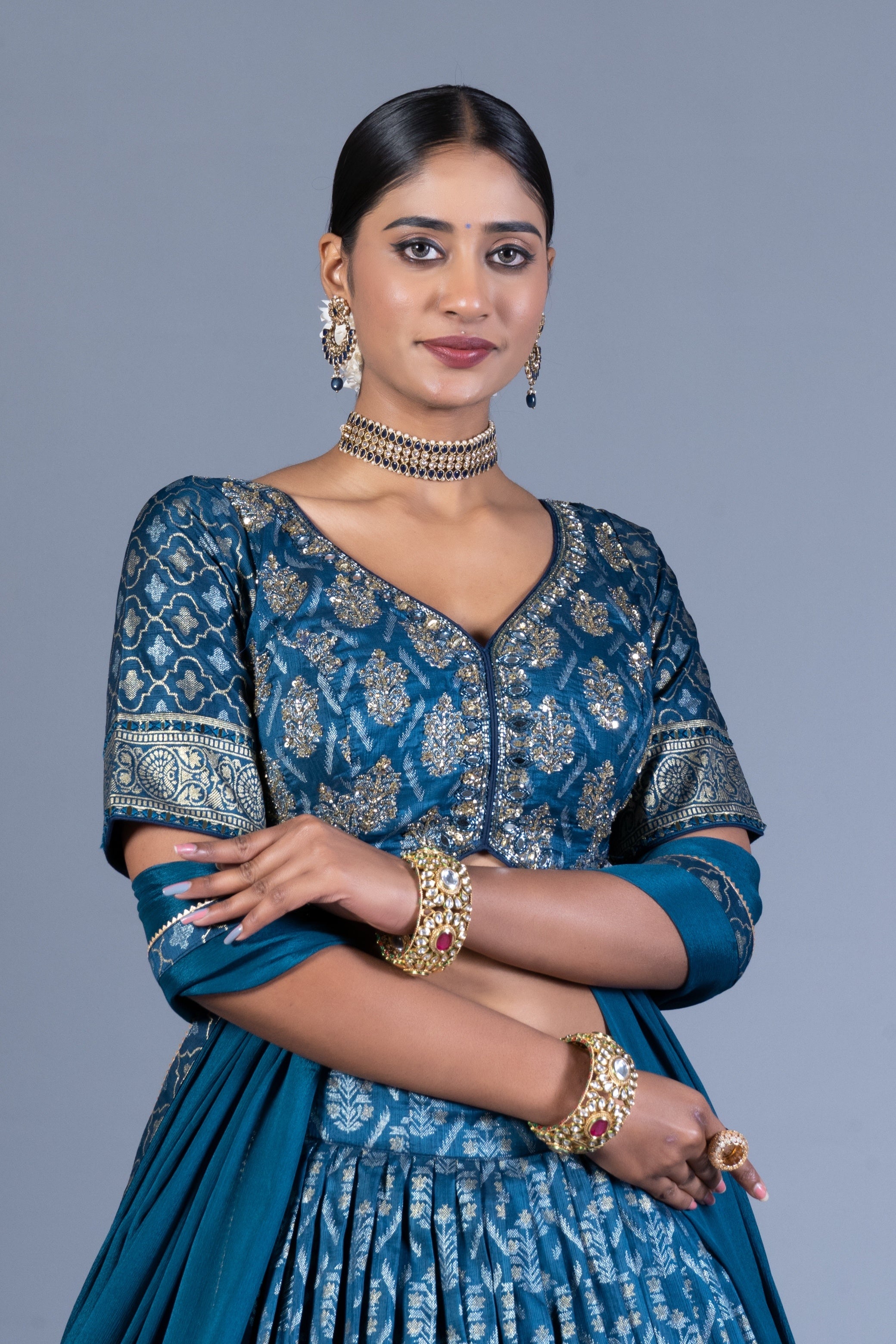 Teal Blue Patola Print Pleated Lehenga Choli with Embroidered Silk Blouse and Zari Border