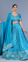 Turquoise Blue Patola Print Pleated Lehenga Set with Sequin Embroidered Blouse and Zari Border