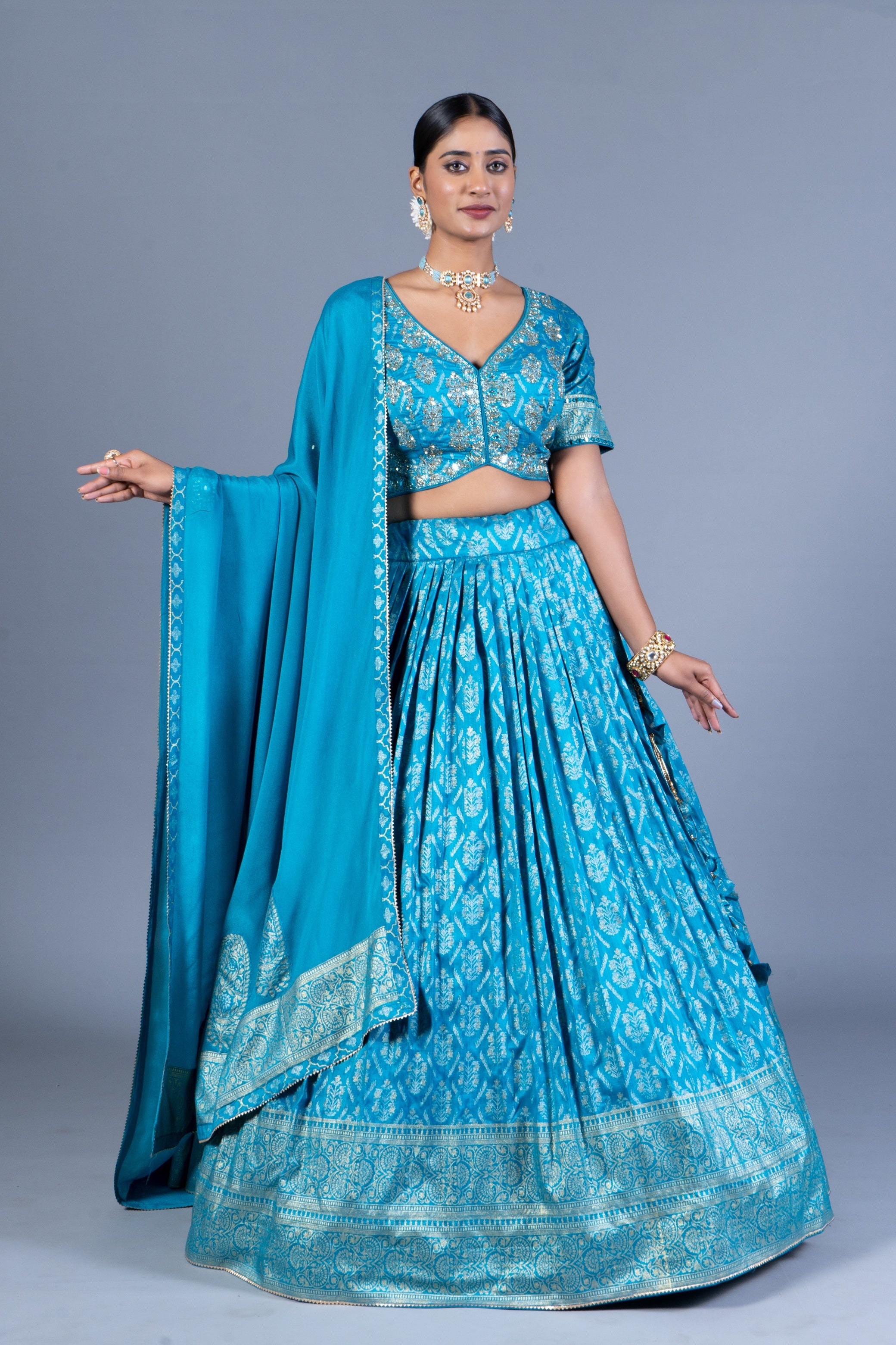 Turquoise Blue Patola Print Pleated Lehenga Set with Sequin Embroidered Blouse and Zari Border