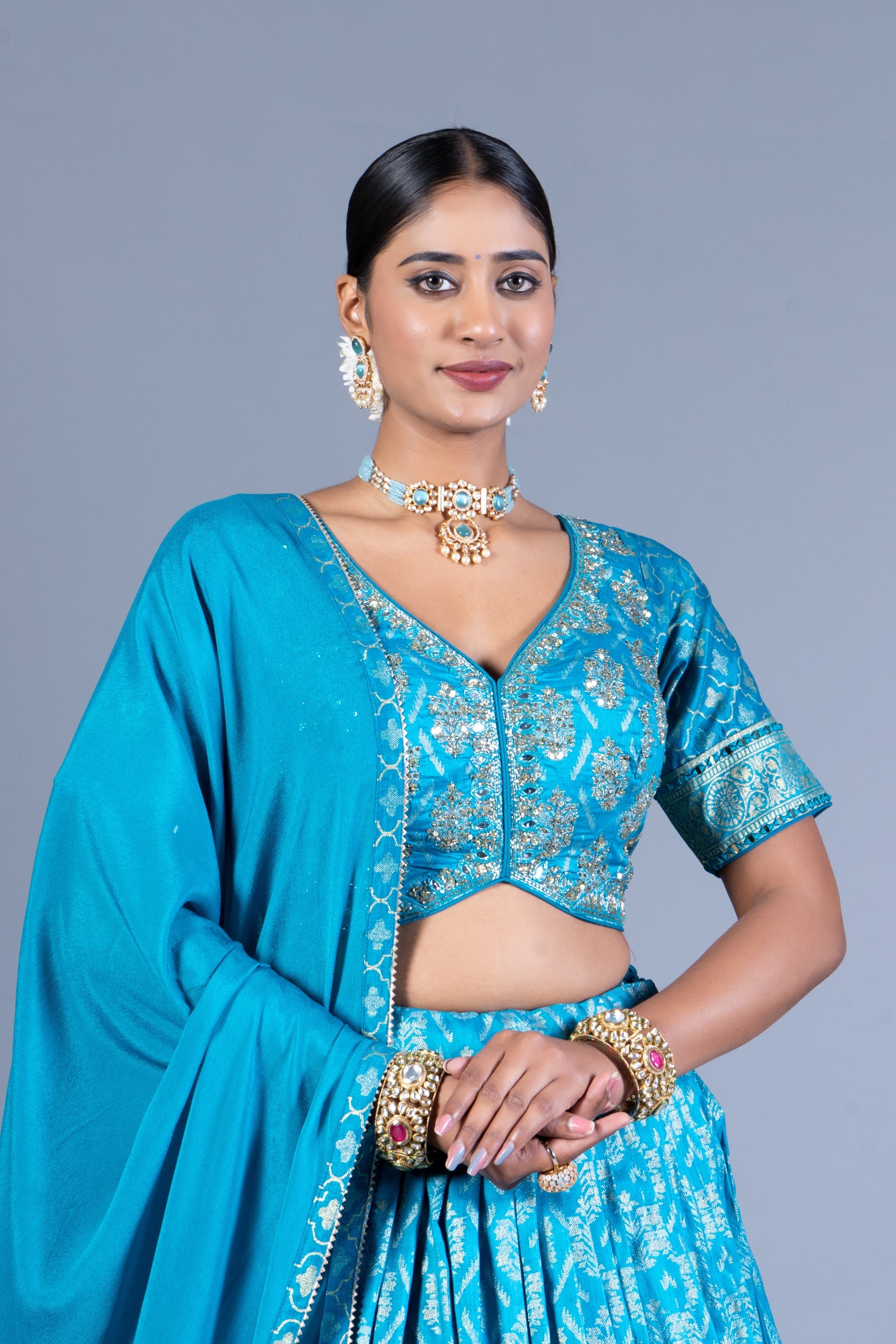 Turquoise Blue Patola Print Pleated Lehenga Set with Sequin Embroidered Blouse and Zari Border