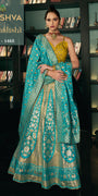 Turquoise Blue & Yellow Banarasi Silk Lehenga Choli with Gold Zari Kalis