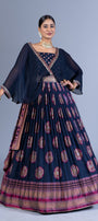 Regal Navy Blue Weaving Silk Gown with Chiffon Cape Overlay and Elephant Motif Butta