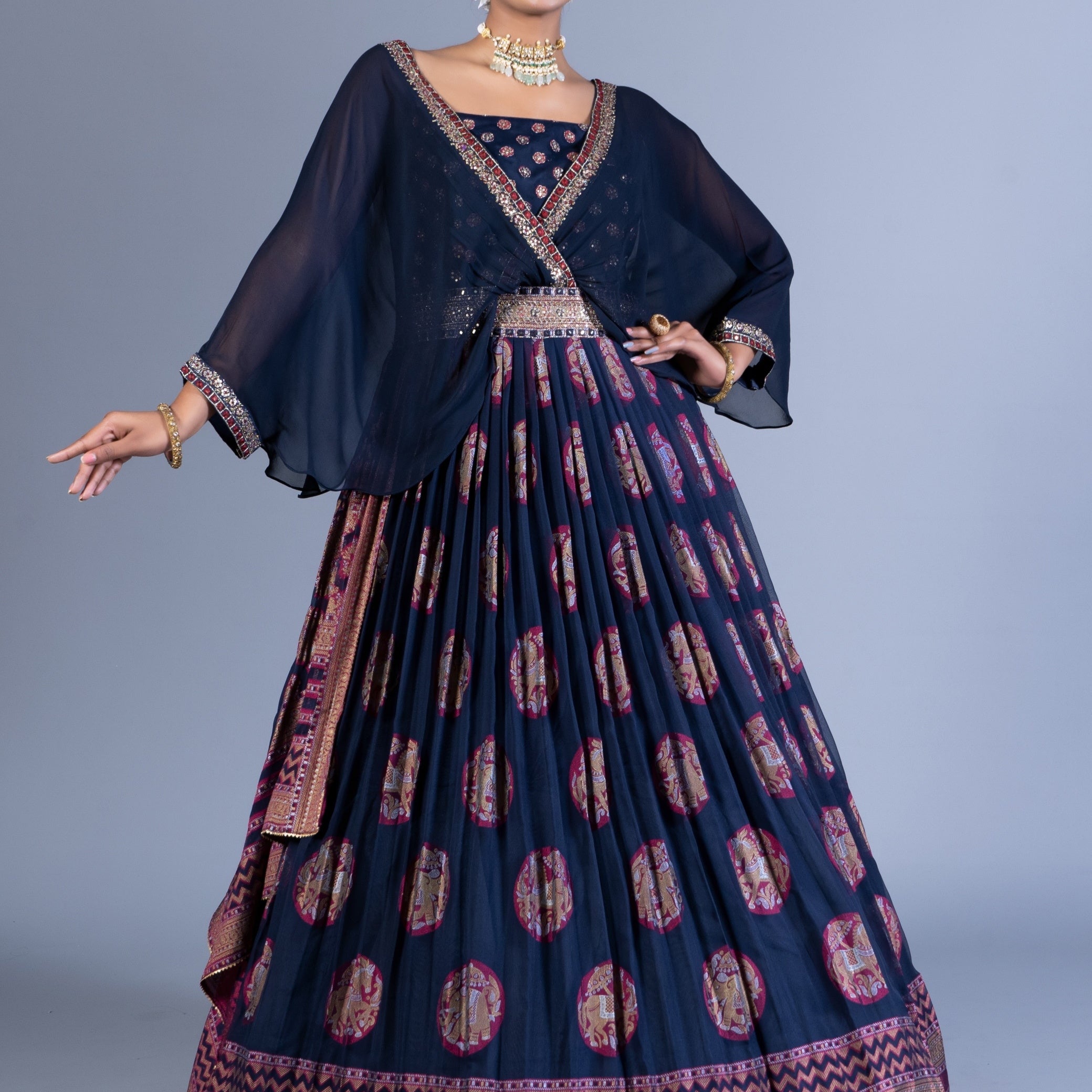 Regal Navy Blue Weaving Silk Gown with Chiffon Cape Overlay and Elephant Motif Butta