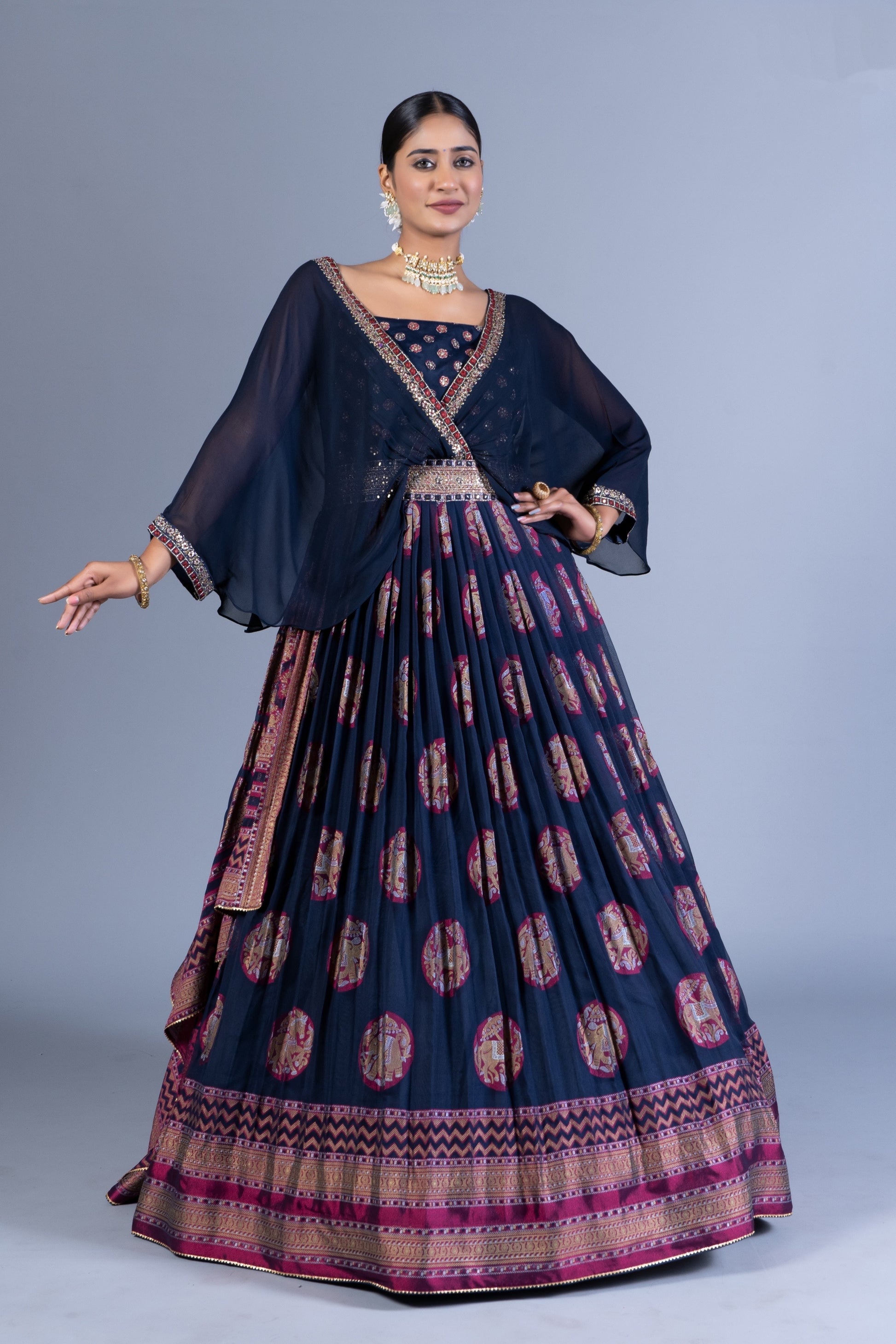 Regal Navy Blue Weaving Silk Gown with Chiffon Cape Overlay and Elephant Motif Butta