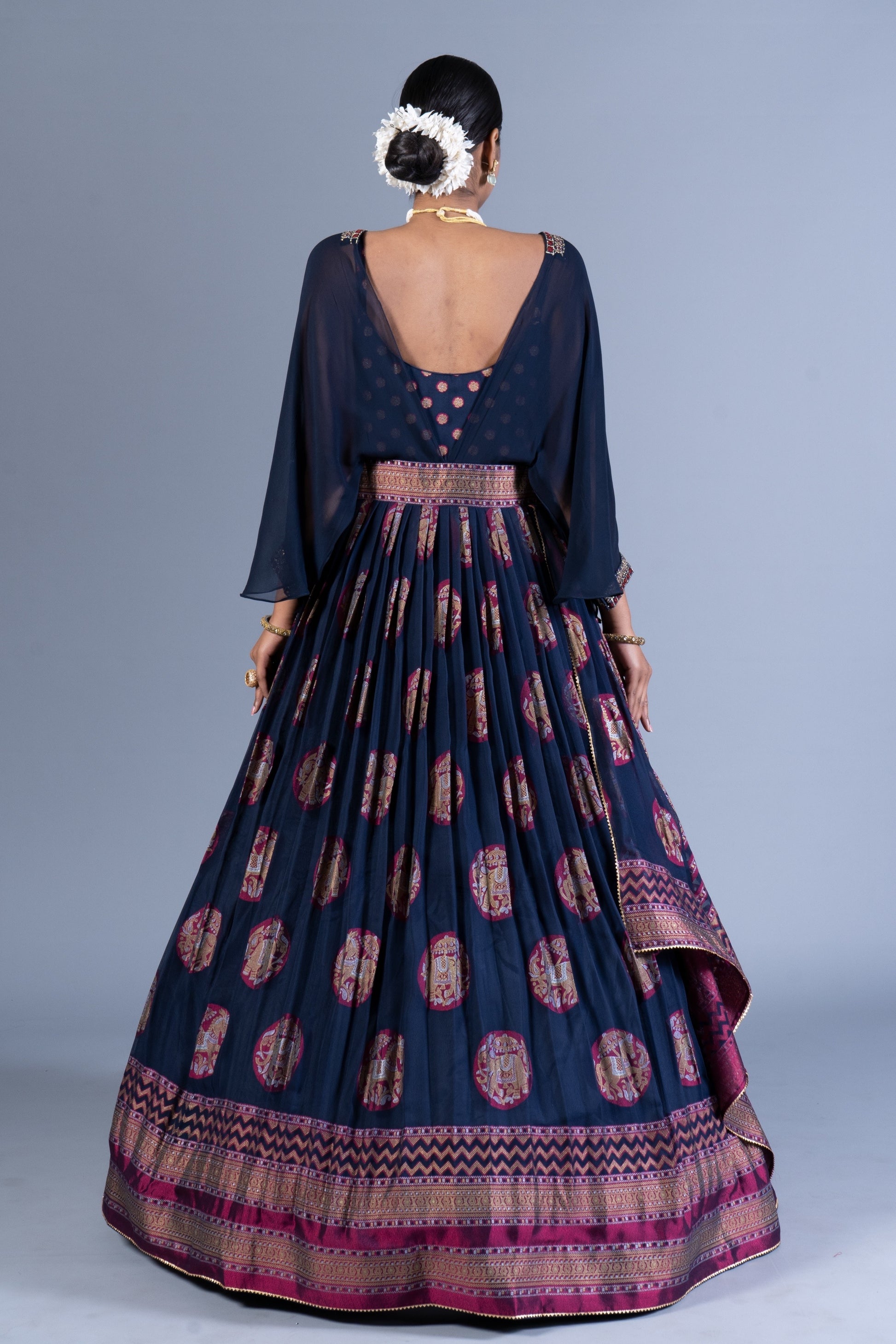 Regal Navy Blue Weaving Silk Gown with Chiffon Cape Overlay and Elephant Motif Butta