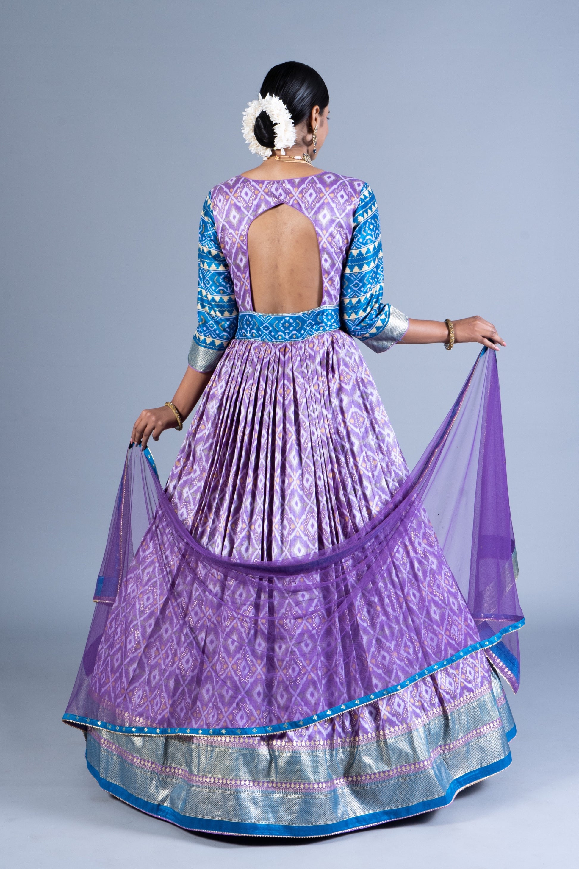 Exquisite Lavender & Teal Patola Silk Fusion Gown with Sequined V-Neck and Net Dupatta