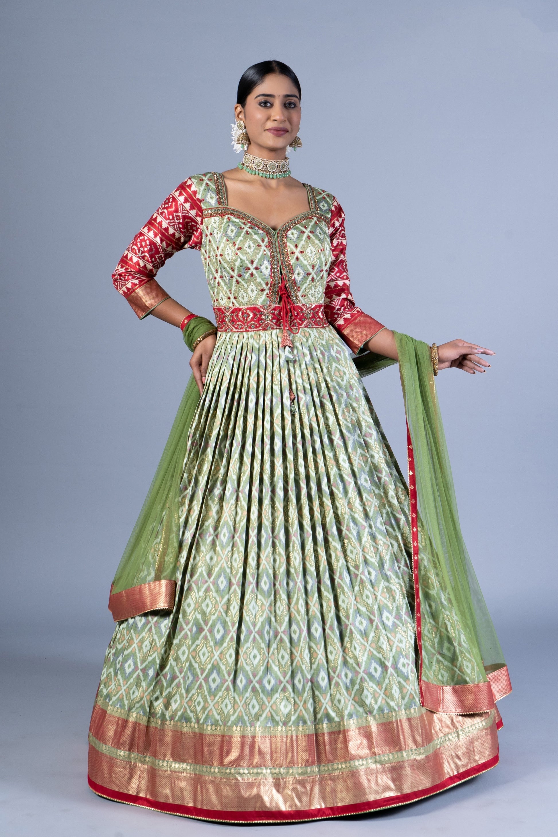 Royal Sage Green & Crimson Patola Silk Fusion Gown with Zari Border and Keyhole Back