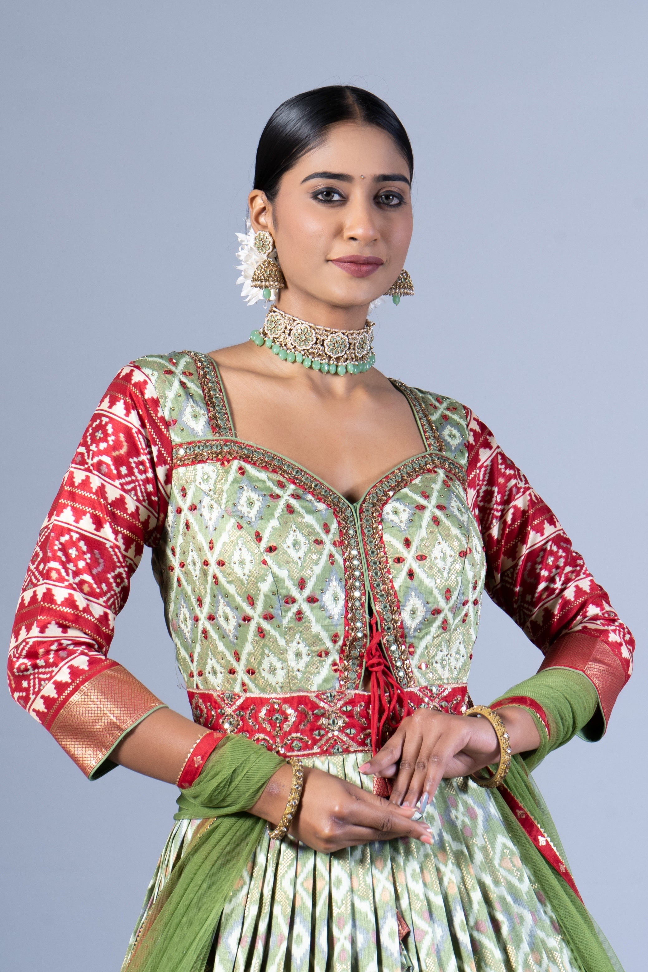 Royal Sage Green & Crimson Patola Silk Fusion Gown with Zari Border and Keyhole Back