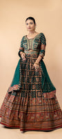 Royal Emerald Green Weaving Silk Gown with Shikargah Motifs and Embroidered Waistband