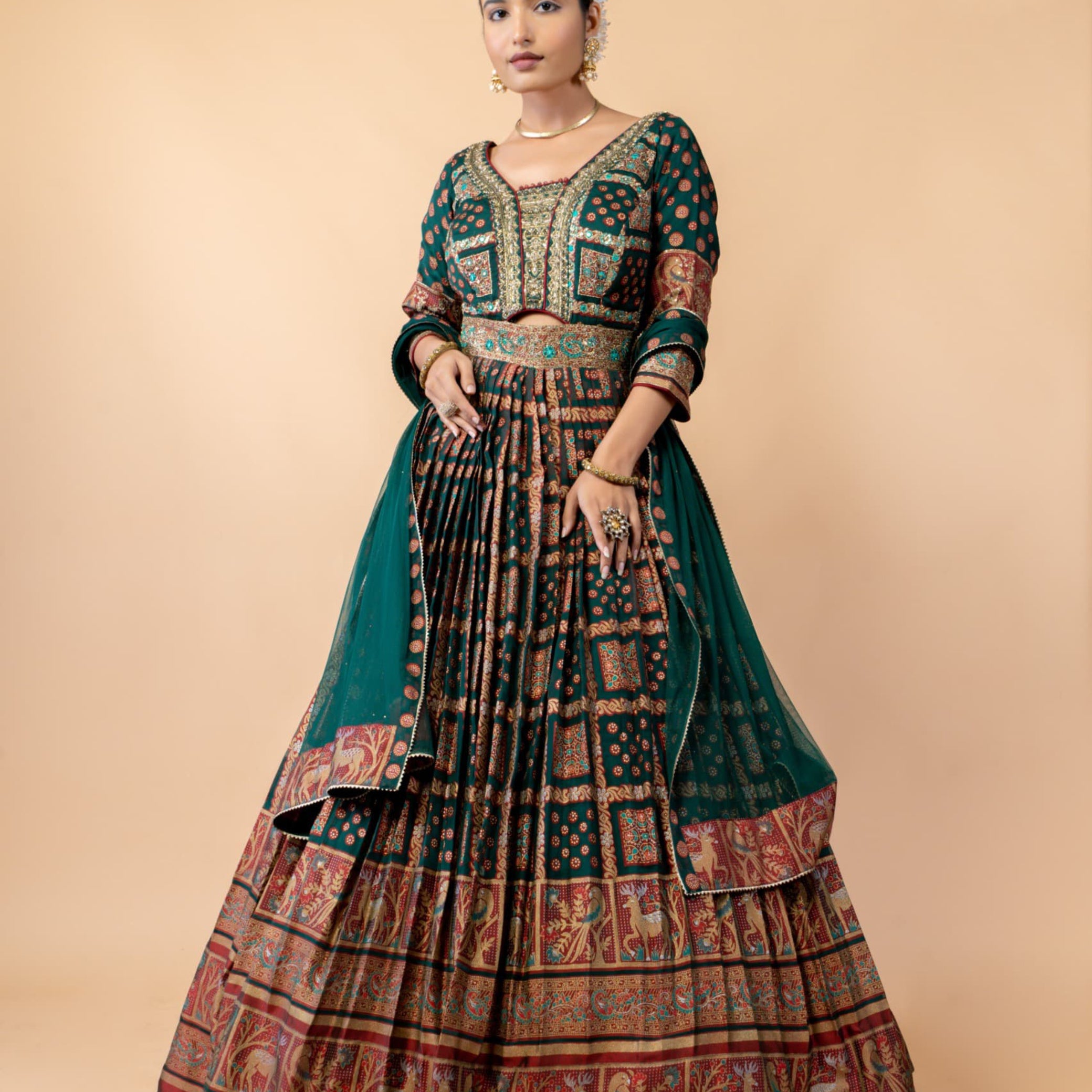 Royal Emerald Green Weaving Silk Gown with Shikargah Motifs and Embroidered Waistband