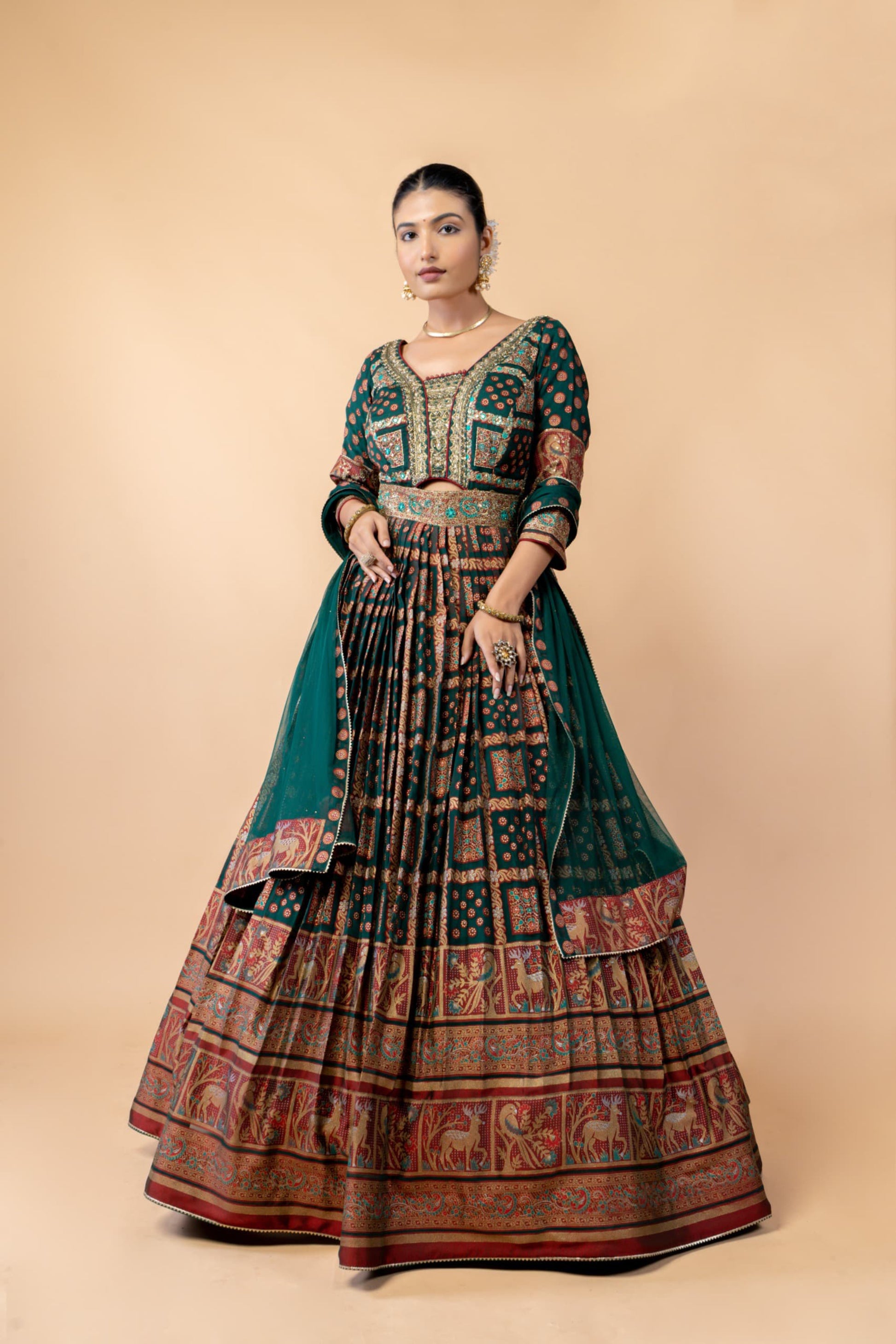 Royal Emerald Green Weaving Silk Gown with Shikargah Motifs and Embroidered Waistband