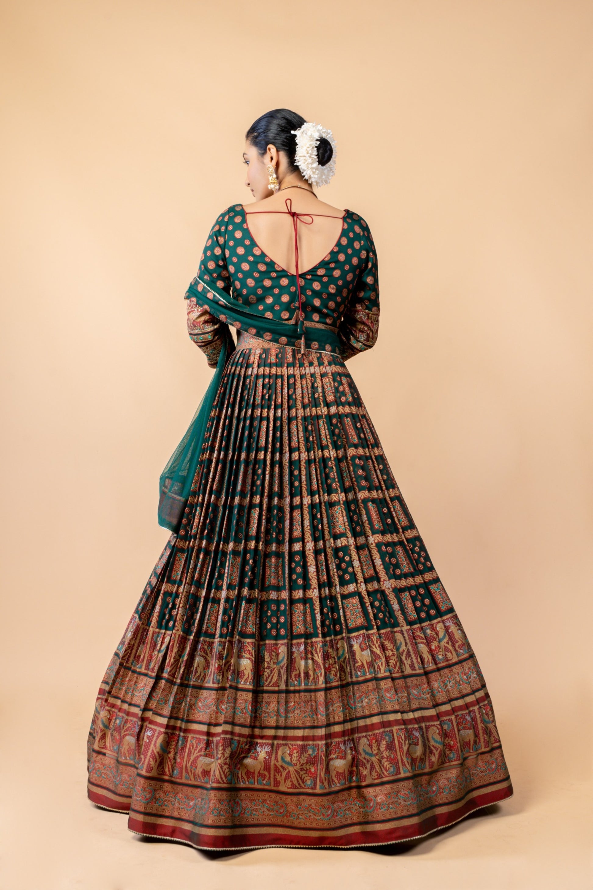 Royal Emerald Green Weaving Silk Gown with Shikargah Motifs and Embroidered Waistband