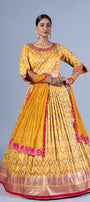 Radiant Mustard Yellow Patola Silk Gown with Embroidered Round Neck and Keyhole Back