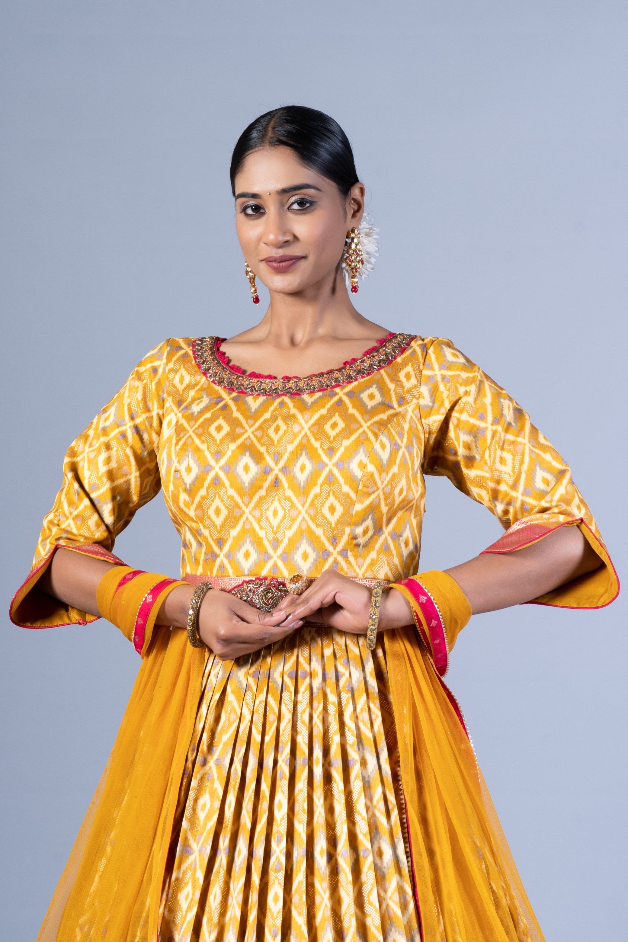 Radiant Mustard Yellow Patola Silk Gown with Embroidered Round Neck and Keyhole Back