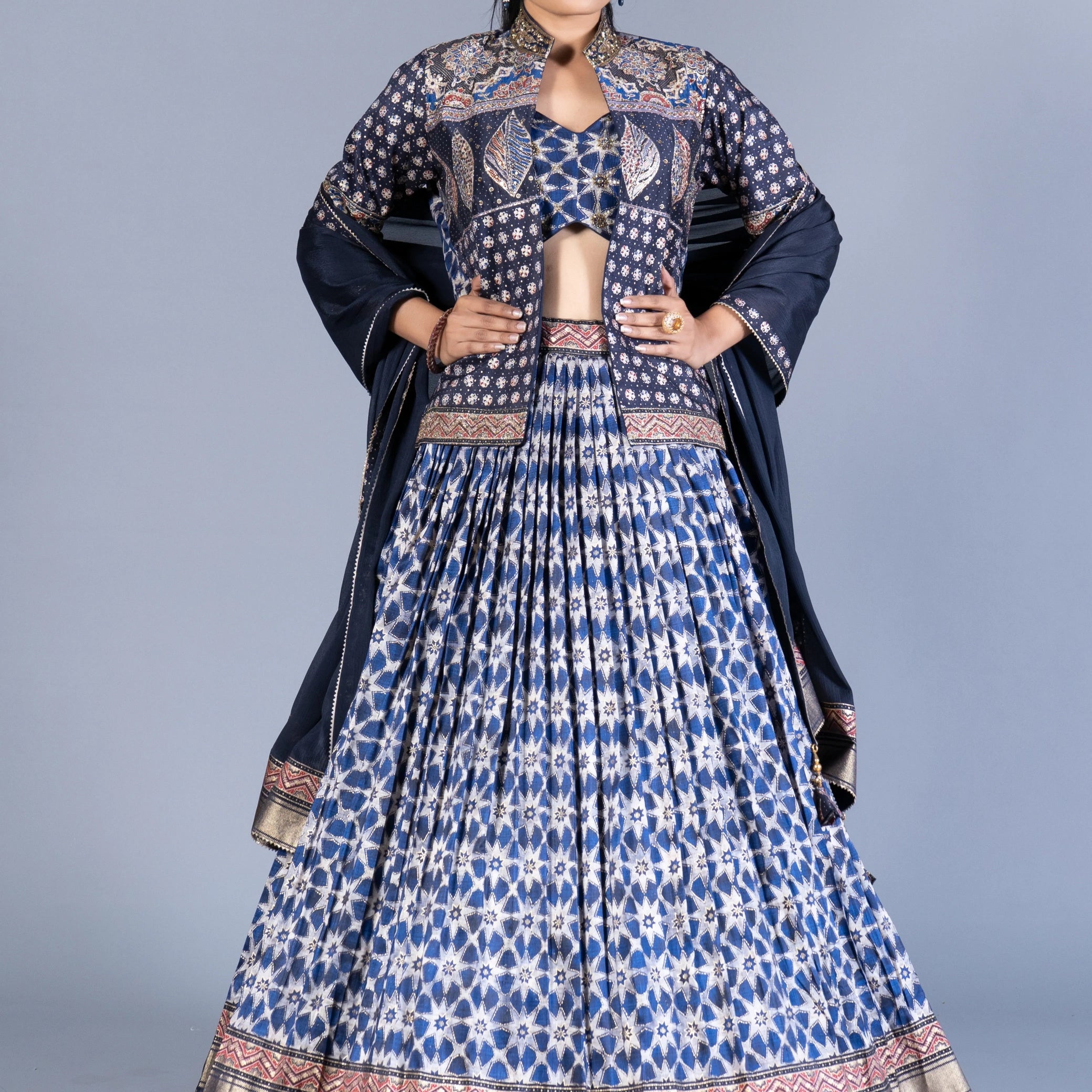 Indigo Blue Ajrakh Print Pleated Lehenga Set with Embroidered Crop Top and Long Jacket