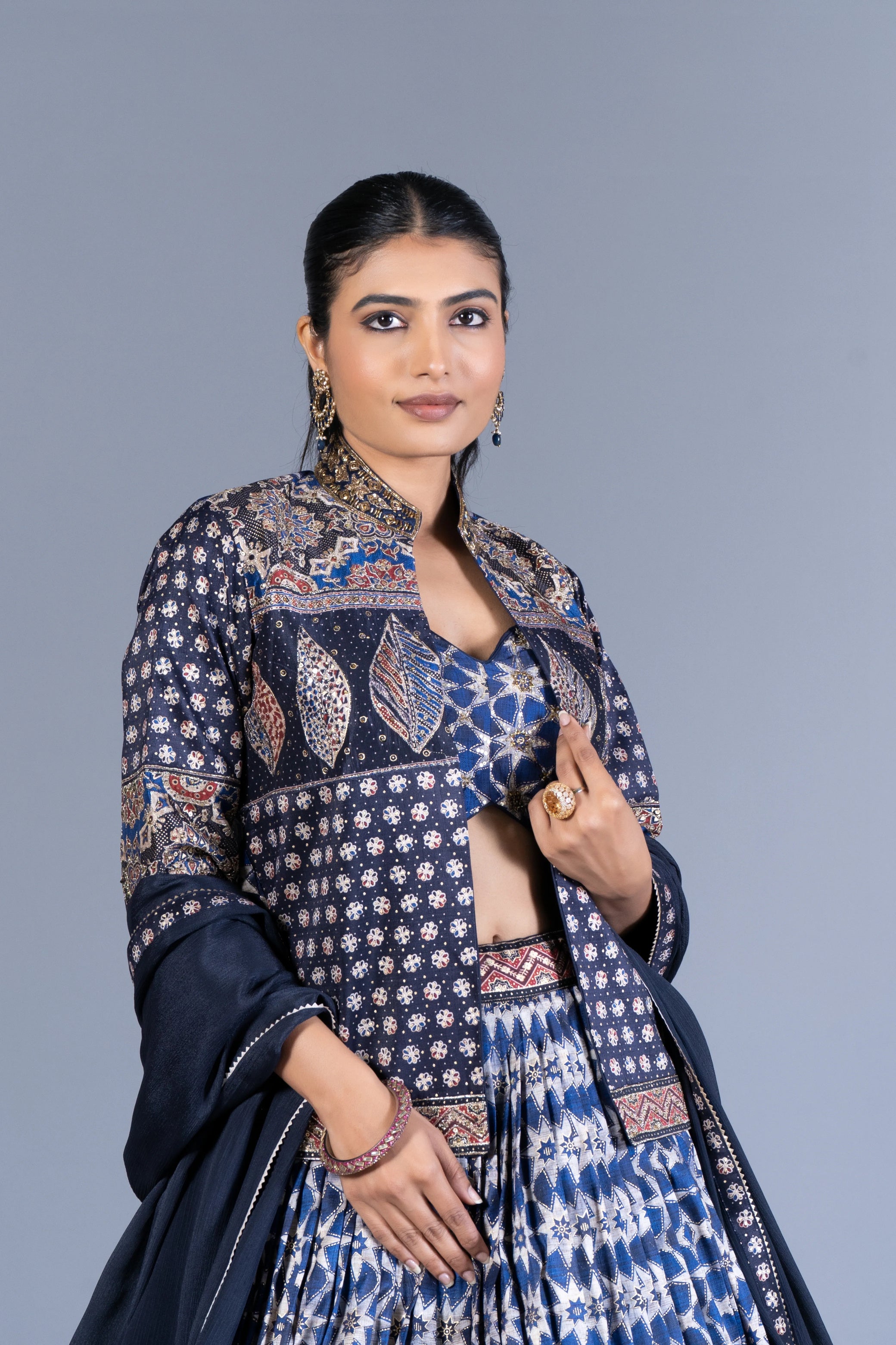 Indigo Blue Ajrakh Print Pleated Lehenga Set with Embroidered Crop Top and Long Jacket